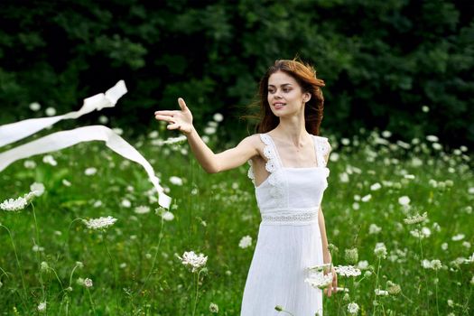 cheerful woman outdoors flowers freedom summer. High quality photo