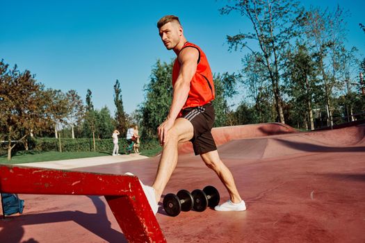 athletic man in red jersey workout exercise pumped up body. High quality photo