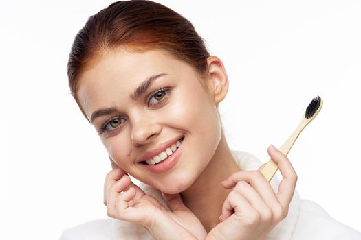 Woman in white coat toothbrush oral hygiene. High quality photo