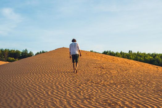 A man lost in the red desert in Vietnam, Mui Ne.