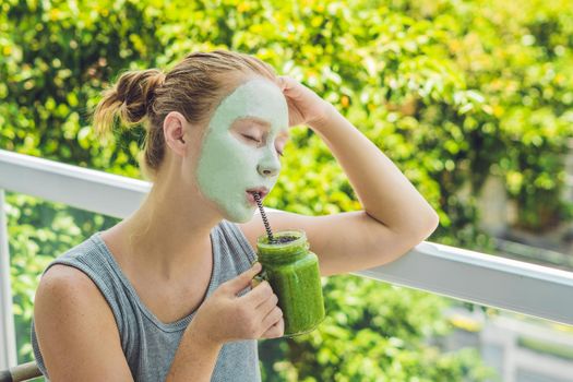 Spa Woman applying Facial green clay Mask. Beauty Treatments. Fresh green smoothie with banana and spinach with heart of sesame seeds. Love for a healthy raw food concept. Detox Concept.