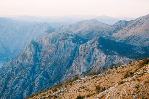 Mountain range over the bay in the fog. Mount Lovcen. High quality photo