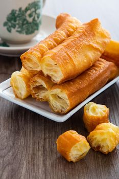 Youtiao (Chinese fried breadstick). Long golden brown deep fried dough strip.