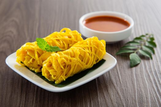 Roti Jala or lace pancake is Malaysian traditional food, a popular Malay snack served with curry dishes