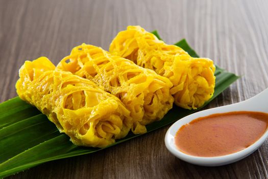 Roti Jala or lace pancake is Malaysian traditional food, a popular Malay snack served with curry dishes