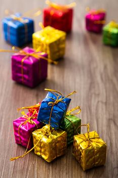 Christmas composition. Christmas gifts, decorations on wooden background. Copy space