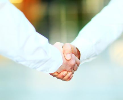 Business men hand shake in the office