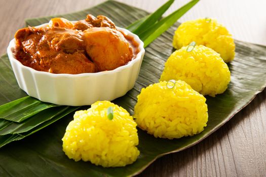 Turmeric Glutinous Rice also known as Nasi Kunyit. Normally eaten with dry curry chicken.