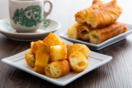 Youtiao (Chinese fried breadstick). Long golden brown deep fried dough strip.