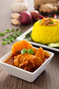 Turmeric Glutinous Rice also known as Nasi Kunyit. Normally eaten with dry curry chicken.