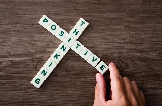 Words of positive thinking concepts collected in crossword with wooden cubes