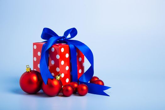 Christmas composition. Christmas gifts, decorations on blue background.