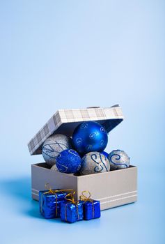 Christmas composition. Christmas gifts, decorations on blue background.