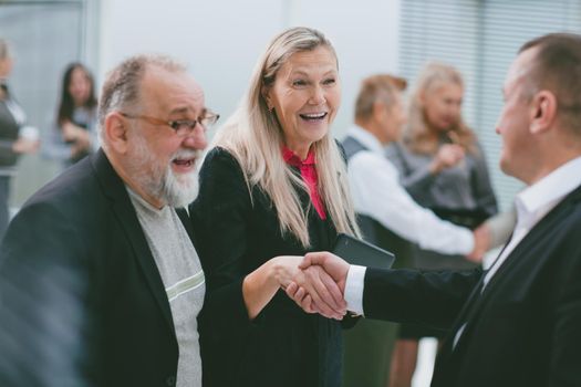 close up. participants of the business seminar greet each other.