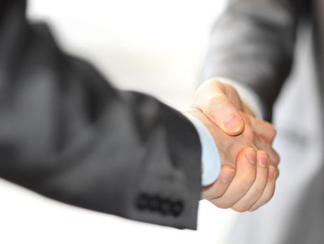 Closeup of a business hand shake between two colleagues