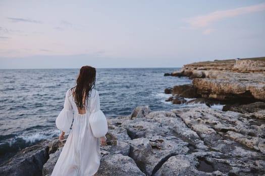 woman traveler enjoying for view of the beautiful sea on her holiday nature. High quality photo