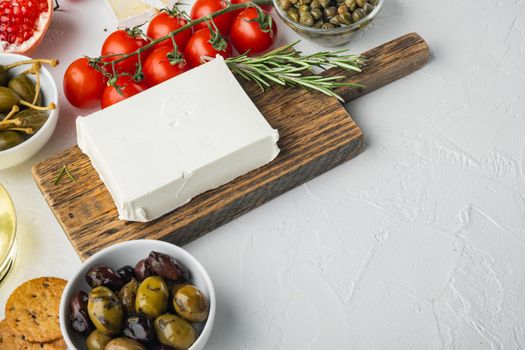 Ingredients for traditional greek salad set, on white background with copy space for text