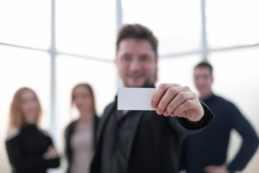 Businessman showing blank business card