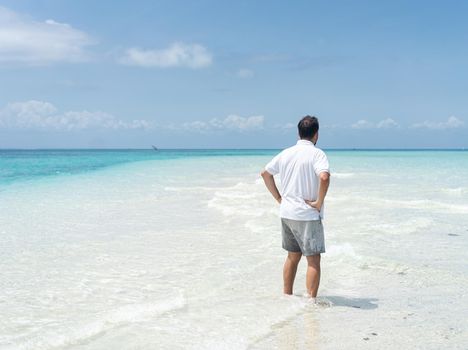 One man is enjoying beautiful tropical beach