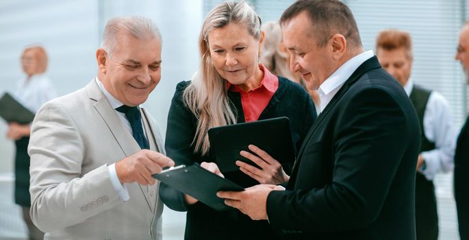 group of business people discussing financial documents. office weekdays