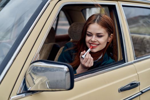 woman peeking out of car trip lifestyle fashion. High quality photo