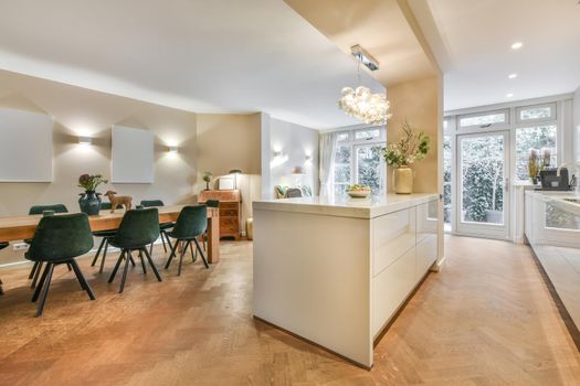 Decorative chairs and wooden table in dining room