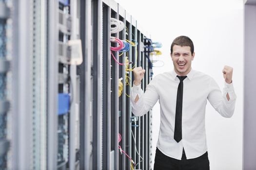 young handsome business man  engeneer in datacenter server room 