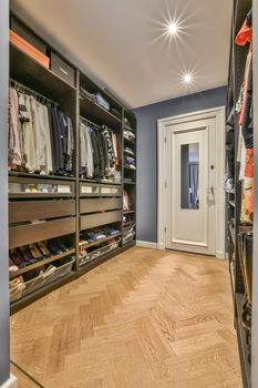 Wardrobe and cabinet in light room at home