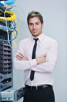 young handsome business man  engeneer in datacenter server room