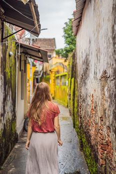 Woman tourist on background of Hoi An ancient town, Vietnam. Vietnam opens to tourists again after quarantine Coronovirus COVID 19.