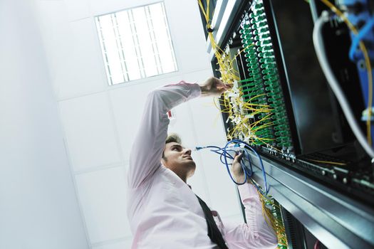 young handsome business man  engeneer in datacenter server room