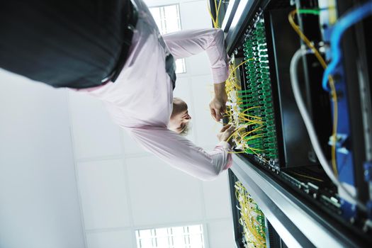 young handsome business man  engeneer in datacenter server room