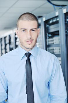 young handsome business man  engeneer in datacenter server room