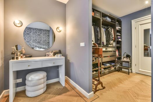 Wardrobe and cabinet in light room at home