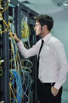 young handsome business man  engeneer in datacenter server room