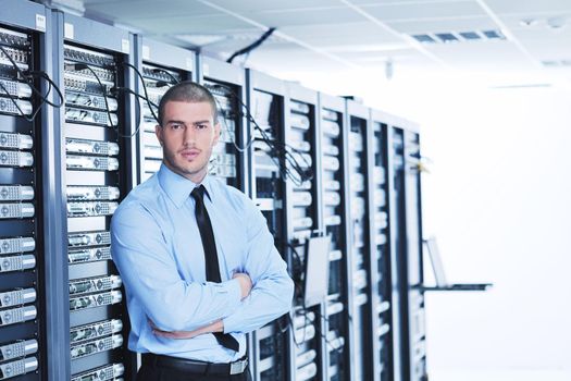 young handsome business man  engeneer in datacenter server room