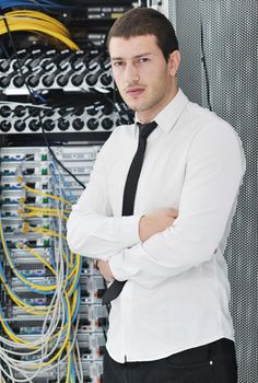 young handsome business man it  engeneer in datacenter server room