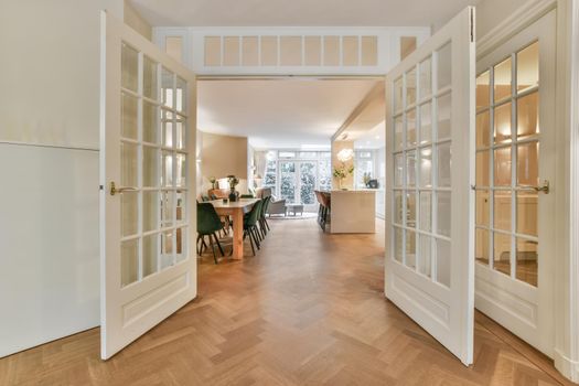 Decorative chairs and wooden table in dining room