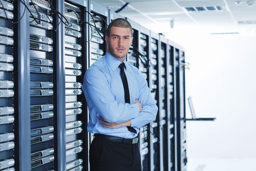 young handsome business man  engeneer in datacenter server room