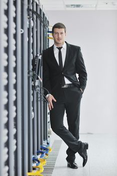 young handsome business man  engeneer in datacenter server room 