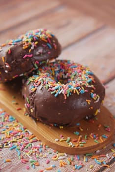 chocolate donuts on plate with copy space.