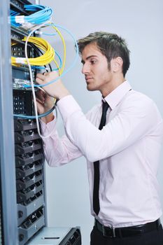 young handsome business man  engeneer in datacenter server room