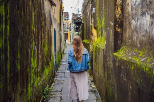 Woman tourist on background of Hoi An ancient town, Vietnam. Vietnam opens to tourists again after quarantine Coronovirus COVID 19.