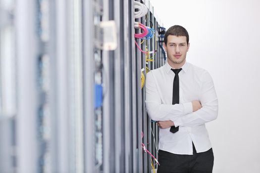 young handsome business man  engeneer in datacenter server room 