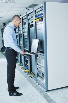 young handsome business man  engeneer in datacenter server room