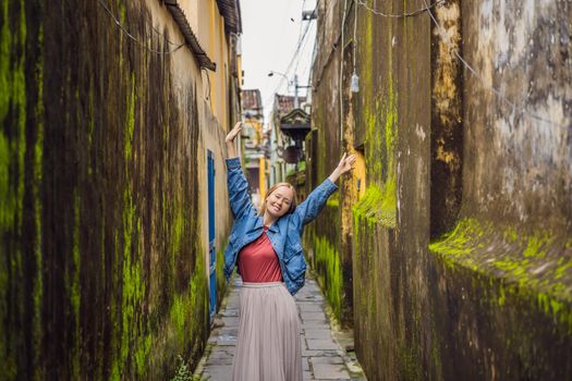 Woman tourist on background of Hoi An ancient town, Vietnam. Vietnam opens to tourists again after quarantine Coronovirus COVID 19.