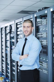 young handsome business man  engineer in datacenter server room