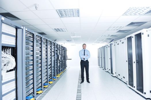 young handsome business man  engeneer in datacenter server room