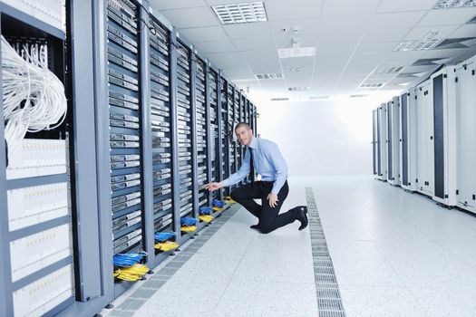 young handsome business man  engeneer in datacenter server room