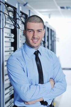 young handsome business man  engeneer in datacenter server room